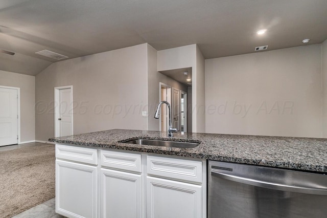5004 Hinson St, Amarillo, TX 79118 - kitchen with dishwasher, carpet flooring, white cabinetry, dark stone countertops, and vaulted ceiling
