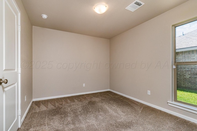5004 Hinson St, Amarillo, TX 79118 - spare room featuring carpet flooring, healthy amount of natural light, and a smoke detector