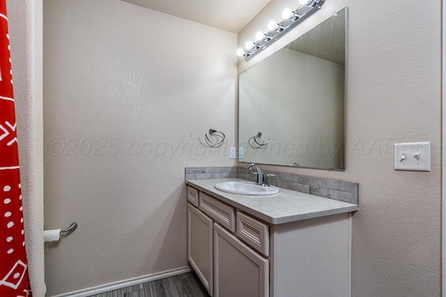 606 Elgin St, Amarillo, TX 79118 - bathroom featuring vanity and wood finished floors