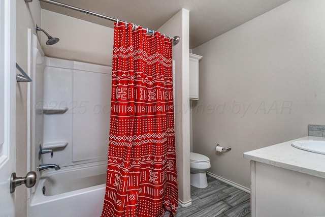 606 Elgin St, Amarillo, TX 79118 - bathroom featuring toilet, vanity, shower / bath combination with curtain, baseboards, and wood finished floors