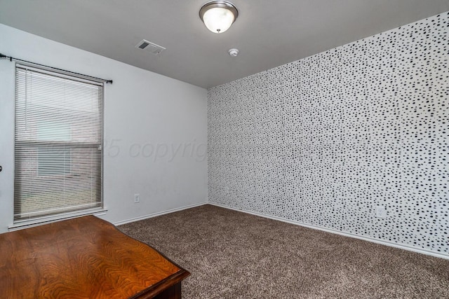606 Elgin St, Amarillo, TX 79118 - carpeted empty room with baseboards and a smoke detector