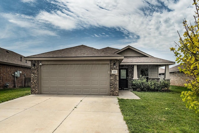 606 Elgin St, Amarillo, TX 79118 - view of front of home with a front yard, an attached garage, concrete driveway, brick siding, and a shingled roof