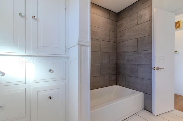 bathroom with tile patterned floors