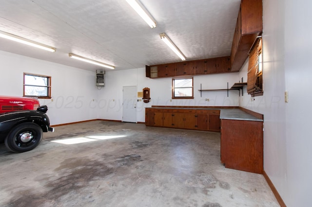 garage featuring baseboards