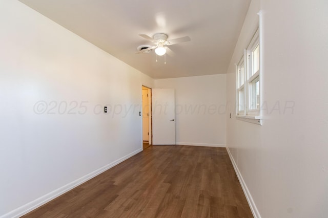 hall with baseboards and wood finished floors