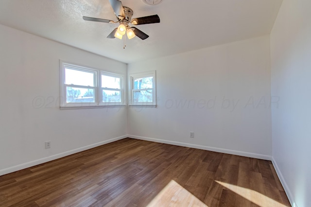 unfurnished room featuring ceiling fan, baseboards, and wood finished floors