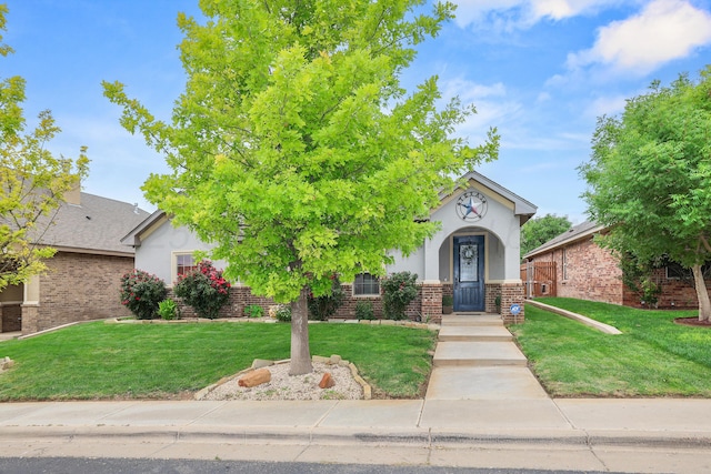 7404 Southbend Dr, Amarillo, TX 79119 - view of property hidden behind natural elements with stucco siding, brick siding, and a front lawn