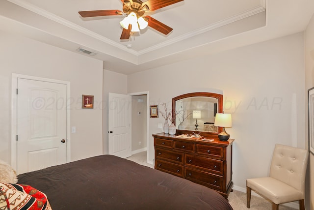 7404 Southbend Dr, Amarillo, TX 79119 - bedroom featuring carpet floors, crown molding, a tray ceiling, and ceiling fan