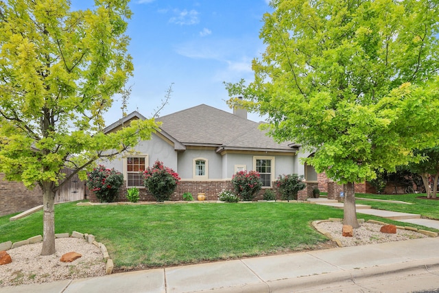 7404 Southbend Dr, Amarillo, TX 79119 - view of front of property with stucco siding, a front lawn, and a shingled roof