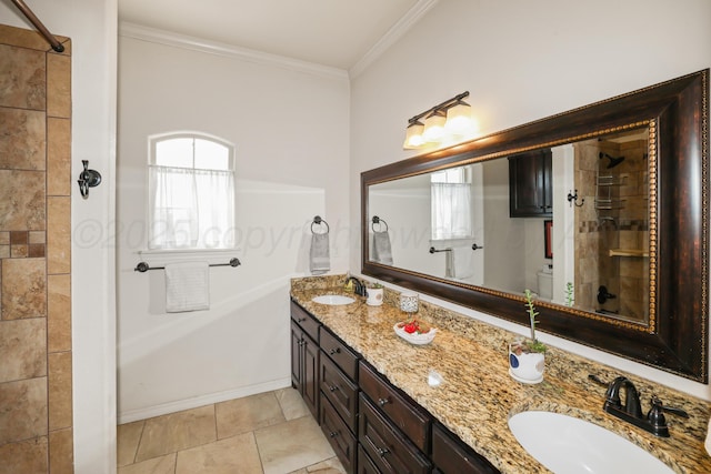 7404 Southbend Dr, Amarillo, TX 79119 - full bathroom featuring double vanity, ornamental molding, and tiled shower