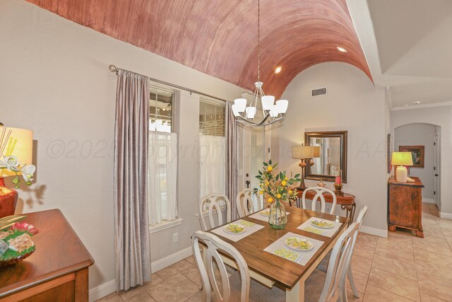 7404 Southbend Dr, Amarillo, TX 79119 - dining space with a chandelier, arched walkways, vaulted ceiling, and light tile patterned flooring