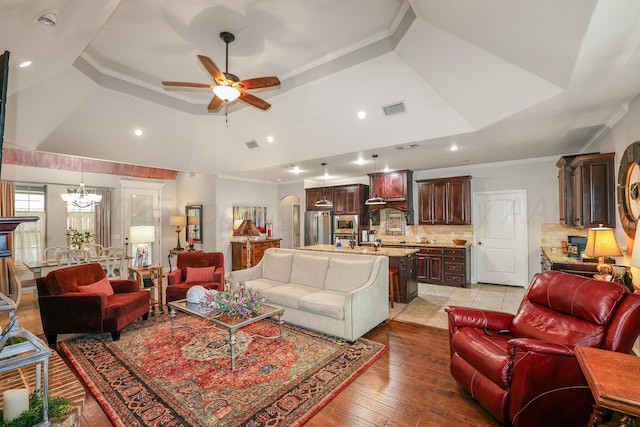 7404 Southbend Dr, Amarillo, TX 79119 - living area with a ceiling fan, a chandelier, a tray ceiling, recessed lighting, and crown molding