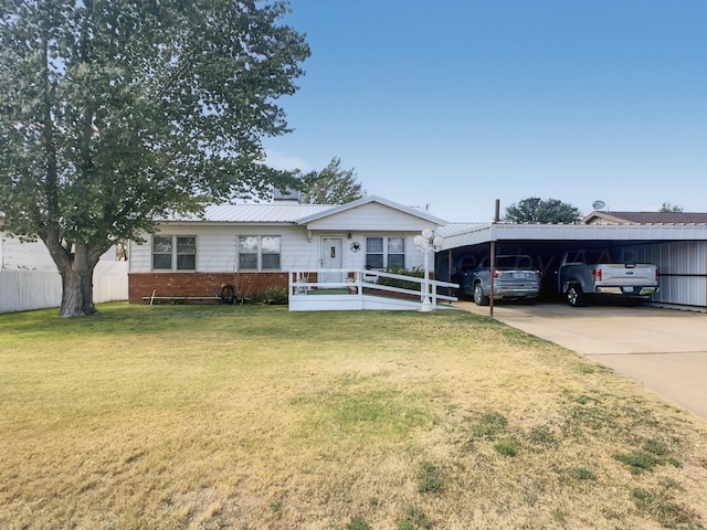 ranch-style house featuring a front yard and a carport