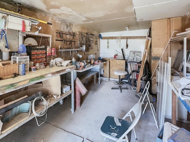 interior space featuring a workshop area and concrete floors