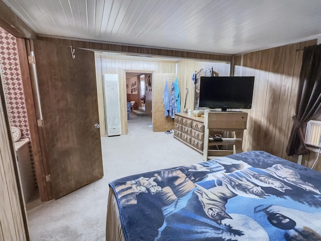 bedroom featuring carpet and wooden walls