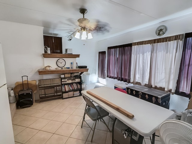 dining area with ceiling fan and light tile patterned floors