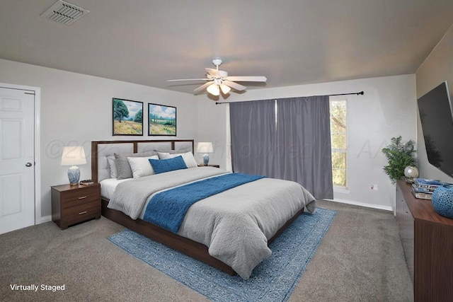 bedroom featuring baseboards, a ceiling fan, carpet flooring, and visible vents