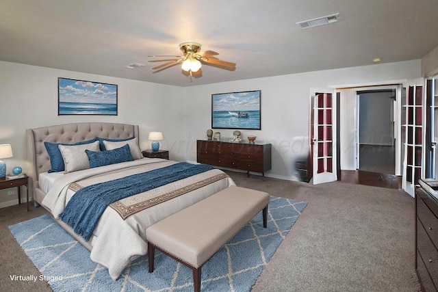carpeted bedroom featuring ceiling fan, baseboards, and visible vents