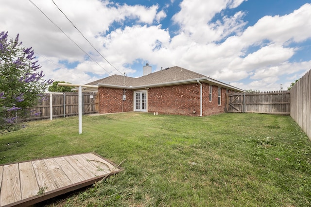 6100 Mckay Ct, Amarillo, TX 79118 - rear view of property with brick siding, a fenced backyard, a deck, french doors, and a chimney
