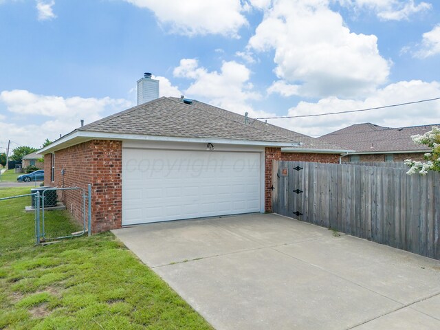 6100 Mckay Ct, Amarillo, TX 79118 - view of side of home featuring brick siding, a gate, roof with shingles, driveway, and an attached garage