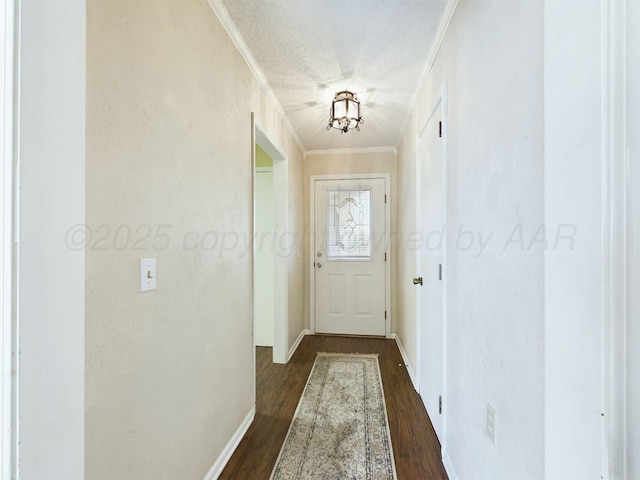 doorway featuring ornamental molding, a textured ceiling, and dark hardwood / wood-style flooring