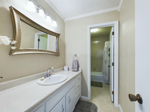 bathroom featuring ornamental molding, tile patterned flooring, a textured ceiling, and vanity