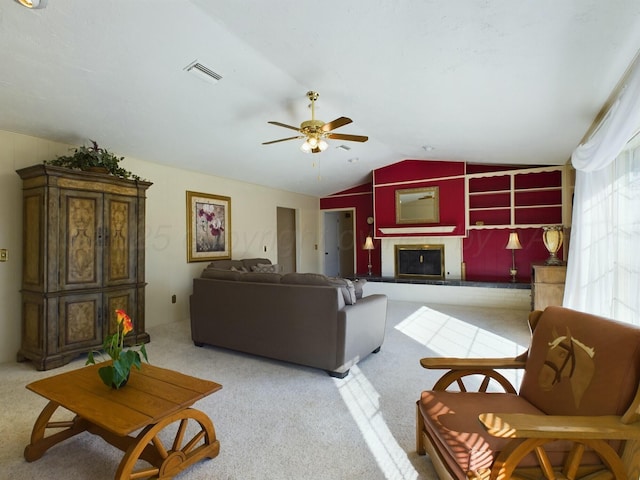 carpeted living room with lofted ceiling and ceiling fan