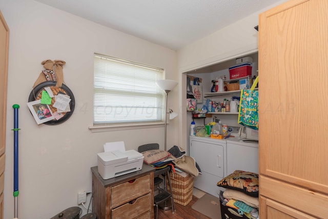 office area with dark hardwood / wood-style flooring and independent washer and dryer