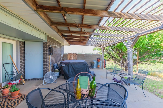 view of patio with a grill and a pergola