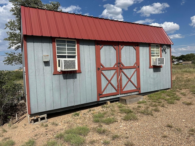 view of outbuilding with cooling unit