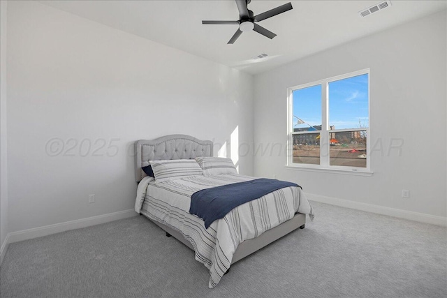 bedroom with carpet, visible vents, and baseboards