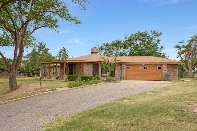 ranch-style house with a garage and a front yard