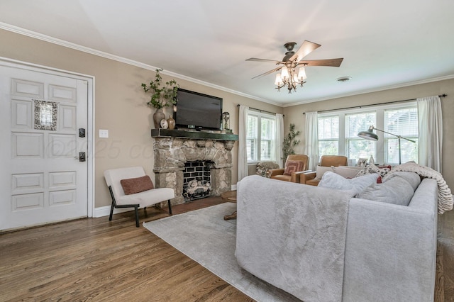501 Sunset Ter, Amarillo, TX 79106 - living area featuring wood finished floors, a fireplace, ornamental molding, ceiling fan, and baseboards