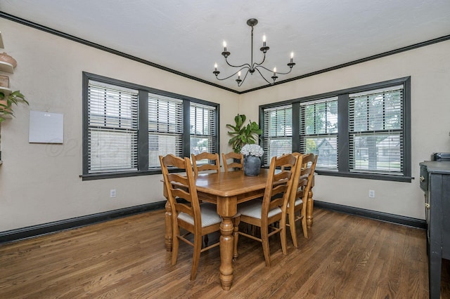 501 Sunset Ter, Amarillo, TX 79106 - dining area with a chandelier, dark wood-type flooring, ornamental molding, and baseboards