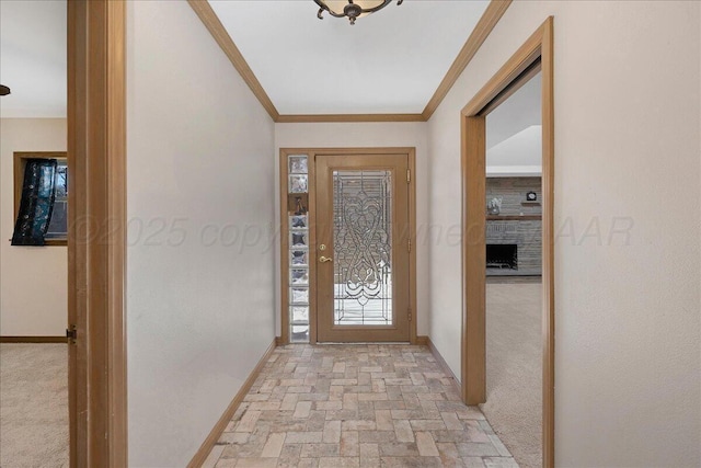 entryway featuring ornamental molding