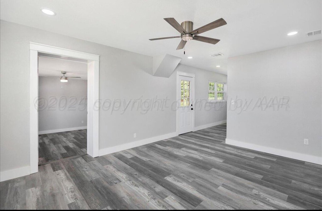 empty room with ceiling fan, wood finished floors, baseboards, and recessed lighting