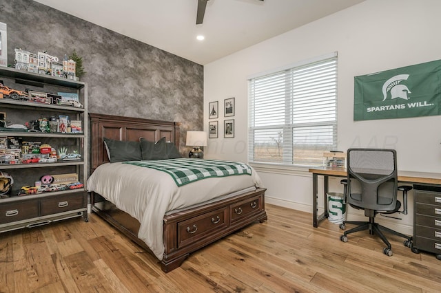 bedroom featuring ceiling fan and light hardwood / wood-style flooring