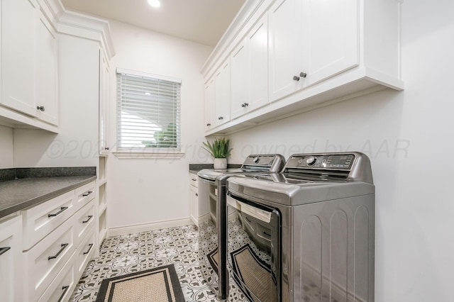 laundry area with cabinets and independent washer and dryer