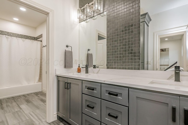 bathroom featuring vanity and shower / bath combo