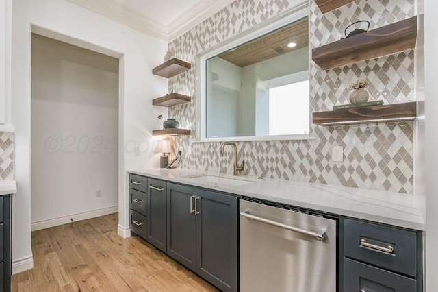 kitchen with dishwasher, sink, light stone counters, crown molding, and light hardwood / wood-style floors