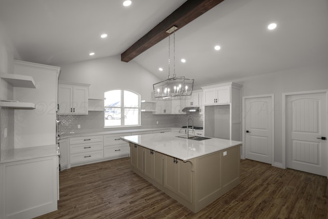 kitchen featuring decorative backsplash, white cabinetry, and a kitchen island with sink