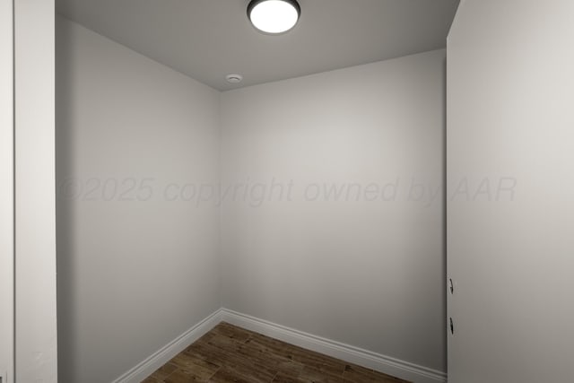 empty room with dark wood-type flooring