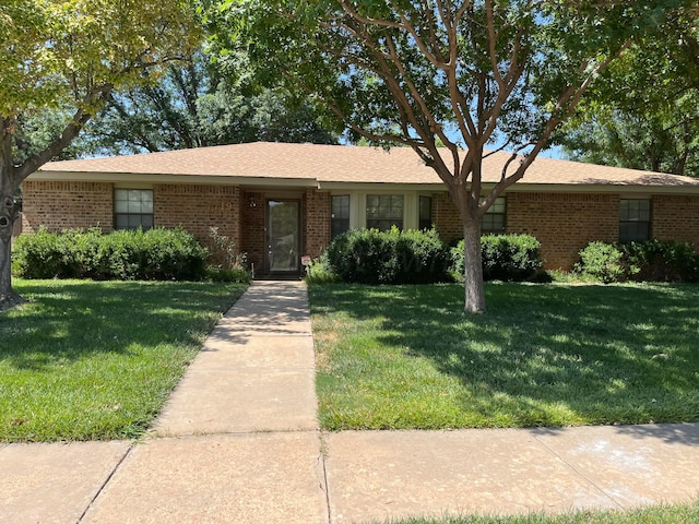 ranch-style house with a front yard