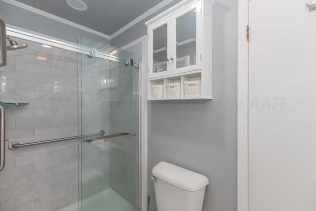 bathroom with toilet, an enclosed shower, and crown molding