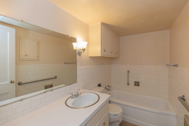 bathroom with vanity, toilet, tile walls, and a tub