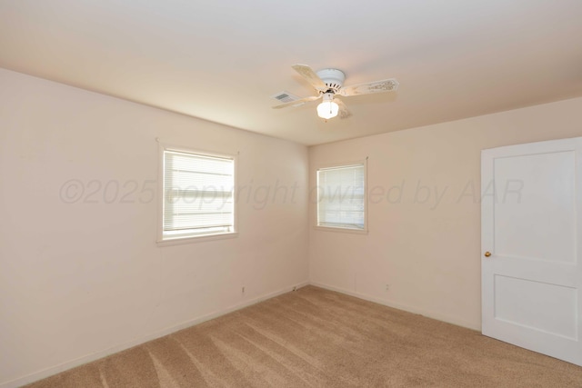 carpeted empty room with ceiling fan