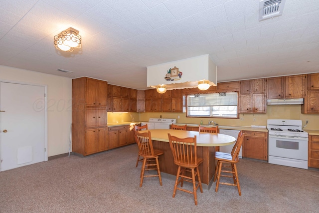 carpeted dining area with sink