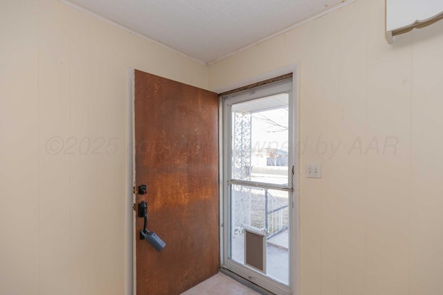 doorway featuring light tile patterned flooring