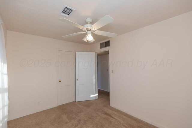 unfurnished bedroom featuring carpet flooring and ceiling fan