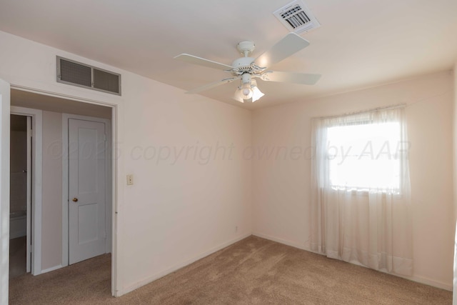 carpeted empty room with ceiling fan